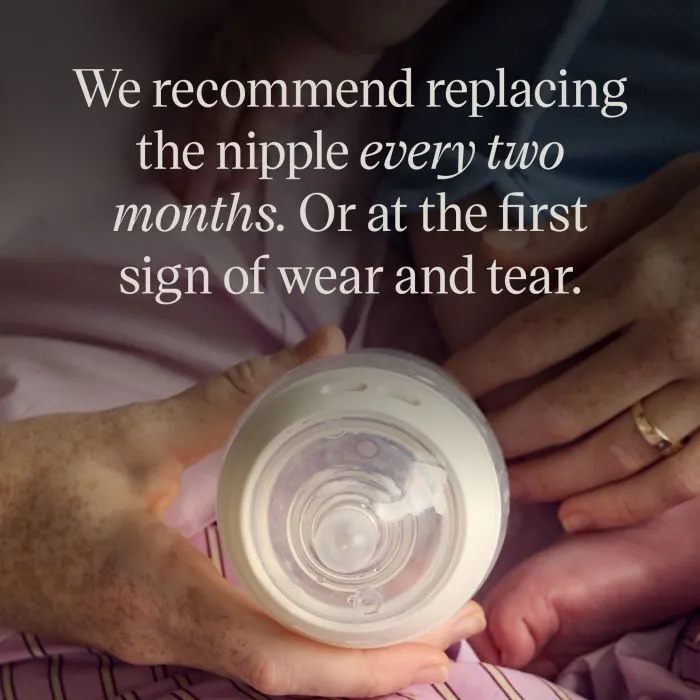 Woman holding a baby and a Natural Start bottle with text overlay about changing the nipple every two months
