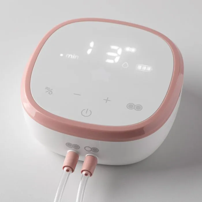 Double electric breast pump power unit on a light grey background