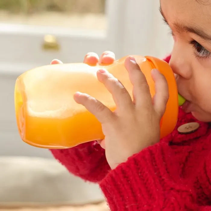 Close up of a child drinking from a Sporty Spout bottle