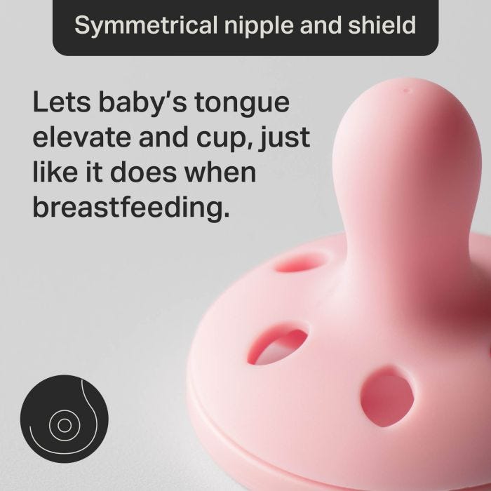 Upward-facing pacifier with text about the symmetrical shield and nipple.