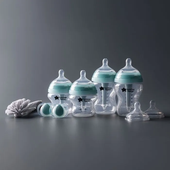 Newborn starter set against a grey background