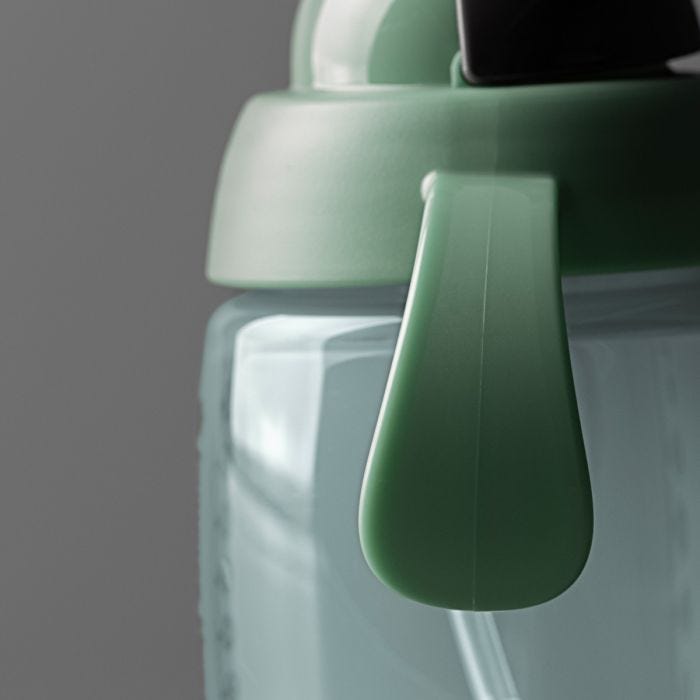 Close up of weighted straw cup on a dark grey background