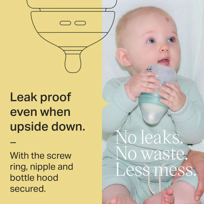 Baby holding an Advanced Anti-colic bottle upside down with text about being leak-proof.
