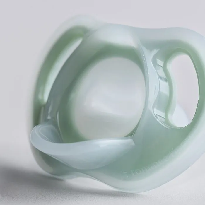 Close up of pacifier on a grey background