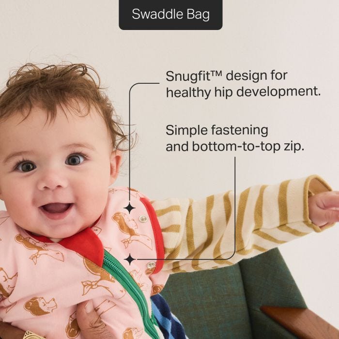 Baby wearing a Swaddle Bag with their arm out with feature text.