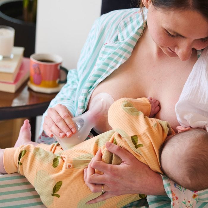 Parent breastfeeding and expressing with the silicone breast pump.