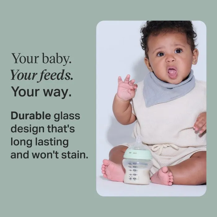 Baby sat on the floor with a Natural Start glass bottle with text overlay of product USP