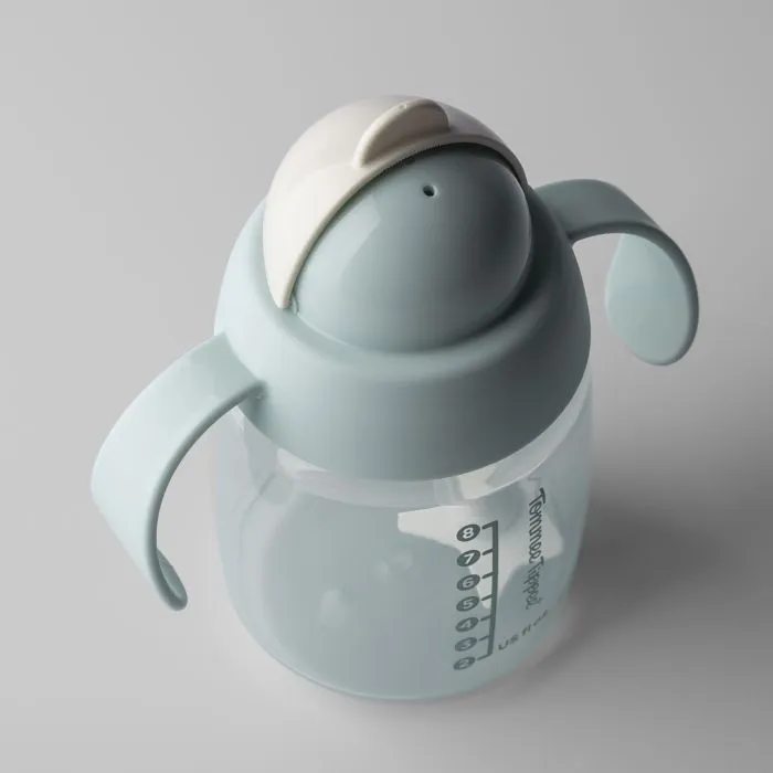 Green starter straw cup against a light grey background