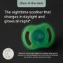 Baby with a Night Glow soother and feature text.