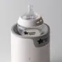 Natural Start bottle in a bottle warmer against a light grey background.