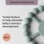 Close-up of the textured teething ring with information on baby&apos;s sensory development.