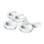 Four milk collector bottles against a white background