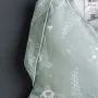 Close up image of Swaddle Bag on dark grey background