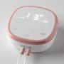 Double electric breast pump power unit on a light grey background