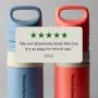 Blue and red on-the-go straw cups against a grey background with text overlay of a customer review