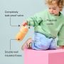 Toddler holding an insulated sporty straw cup against a blue background with pointers to the product key features