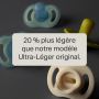 Deux sucettes à lueur nocturne et deux sucettes StayPut derrière le texte de présentation.