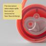 Insulated active spout lid upside down to show the valve against a grey background with text overlay of product messaging