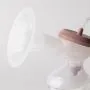 Side shot of an electric breast pump showing the hood.
