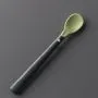 Softee weaning spoon on a grey background