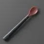 Heat sense spoon on a grey background