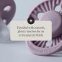 Close-up of a violet glow silicone-coated shield with a customer review.