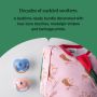 Close-up of a Swaddle Bag neckline and Anytime Soothers below feature text.