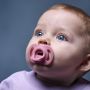 Close-up of a baby with an Ultra-light dummy.