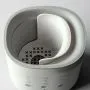 Ariel shot showing the inside of a Multiwarm bottle warmer against a grey background