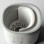 Ariel shot showing the inside of a Multiwarm bottle warmer against a grey background