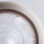 Close up of soother on a grey background