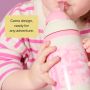 Close up of a toddler drinking from a pink camo insulated straw cup with product feature text