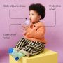Toddler sitting on a yellow box against a pink background drinking from an Active Straw cup with pointers to the key product features
