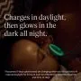 Baby with an illuminated glow in the dark pacifier with feature text.