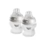 Two Tommee Tippee Natural Start Silicone Coated Glass Bottles against a white background