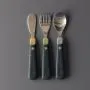 Grown up cutlery set on a grey background