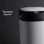 White Twist & Click nappy bin on a grey background with USP tagline