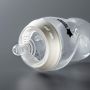 Natural Start bottle laying on its side on a dark grey background.