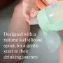Toddler holding a green transition spout cup with text overlay of product USP tagline