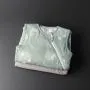 Two folded sleeping bags on a grey background