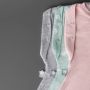 trois gigoteuses pour bébé sur fond gris