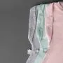 Three baby sleeping bags on a grey background