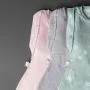 Three baby sleeping bags on a grey background