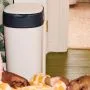 Twist & Click XL nappy bin next to a baby on a changing table in a nursery