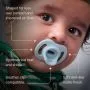 Feature text surrounding a baby with a Ultra-light StayPut soother.