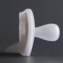 Close up of pacifier on a dark grey background