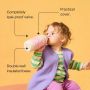 Toddler drinking from a pink camo insulated straw cup against an orange background with pointers to the product key features