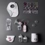 Flat lay of all Complete Breastfeeding Kit contents on charcoal background.