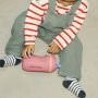 Image of a toddler sat on the floor playing with an Insulated Sporty Spout and Straw Cup