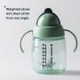 Weighted straw cup on a grey background with text